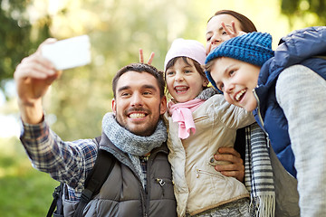 Image showing family taking selfie with smartphone outdoors