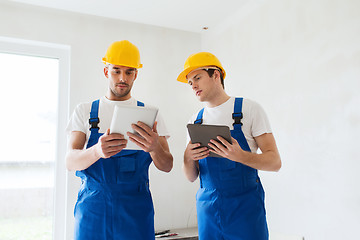 Image showing builders with tablet pc and equipment indoors