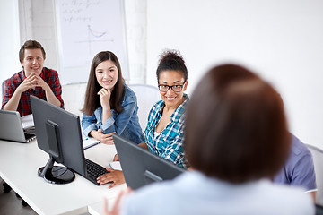 Image showing happy students and teacher in computer class