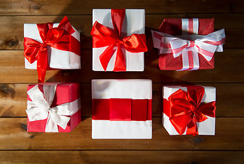 Image showing close up of gift boxes on wooden floor from top