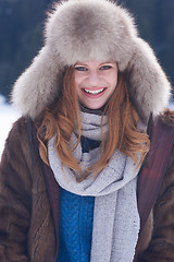 Image showing portrait of beautiful young redhair woman in snow scenery