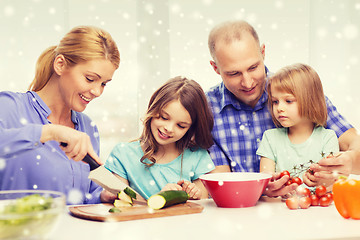 Image showing happy family with two kids making dinner at home