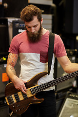 Image showing musician or customer with guitar at music store