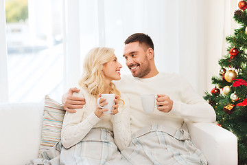 Image showing happy couple at home with christmas tree