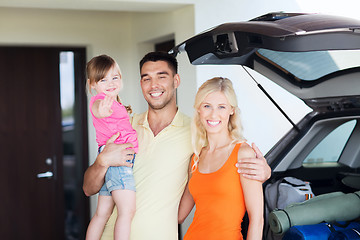 Image showing happy family with hatchback car at home parking