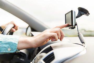 Image showing close up of man with gps navigator driving car