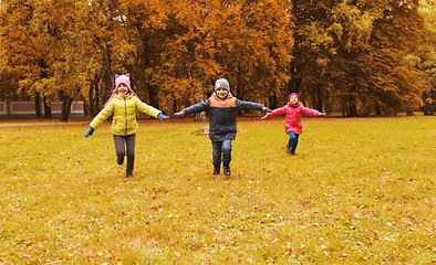 Image showing happy little children running and playing outdoors