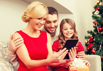 Image showing smiling family with tablet pc