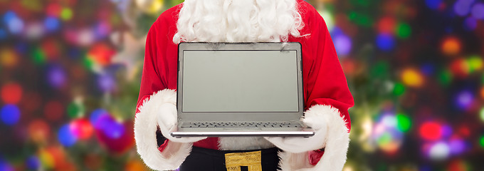 Image showing close up of santa claus with laptop