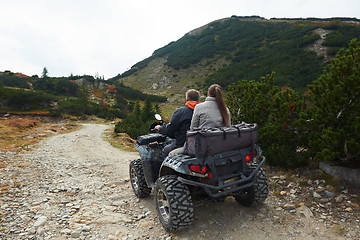 Image showing couple drive atv quad bike