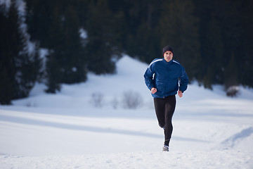 Image showing jogging on snow in forest