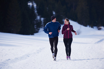 Image showing couple jogging outside on snow