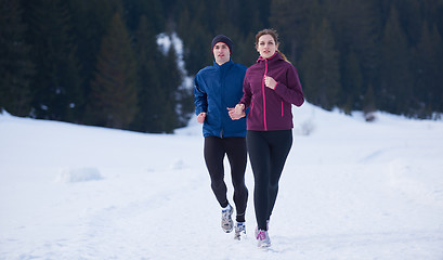 Image showing couple jogging outside on snow