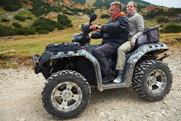 Image showing couple drive atv quad bike