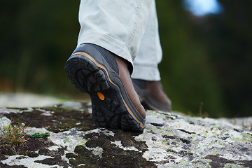 Image showing hiking man with trekking boots