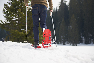 Image showing couple having fun and walking in snow shoes