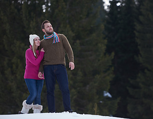 Image showing couple having fun and walking in snow shoes