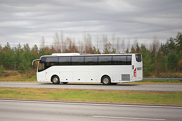 Image showing White Coach Bus on Motorway on a Cloudy Day