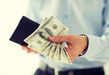 Image showing close up of businessman hands holding money