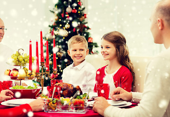 Image showing smiling family having holiday dinner at home