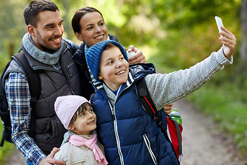 Image showing family taking selfie with smartphone in woods