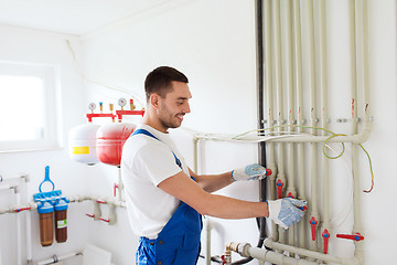 Image showing builder or plumber working indoors