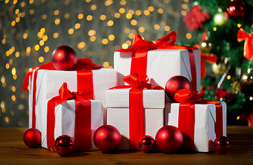 Image showing gift boxes and red balls under christmas tree