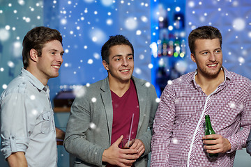 Image showing group of male friends with beer in nightclub