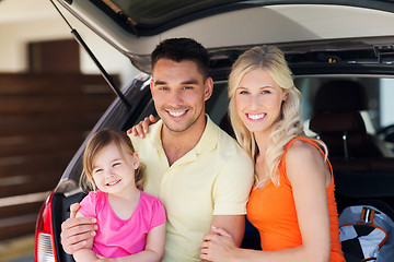 Image showing happy family with hatchback car at home parking