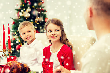 Image showing smiling family having holiday dinner at home