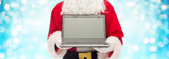 Image showing close up of santa claus with laptop