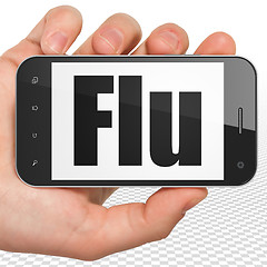 Image showing Medicine concept: Hand Holding Smartphone with Flu on display