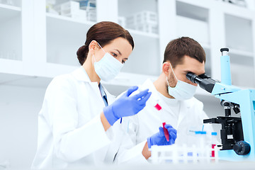 Image showing young scientists making test or research in lab