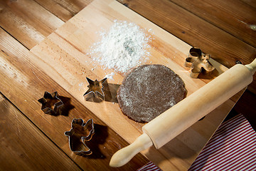 Image showing close up of ginger dough, molds and rolling pin