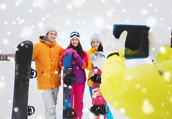 Image showing happy friends with snowboards and tablet pc