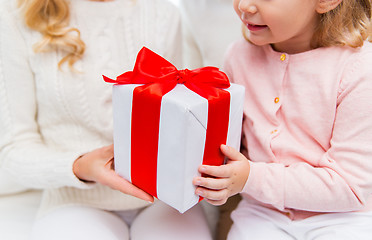Image showing close up of mother and little girl with gift box