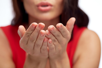 Image showing close up of woman hands sending blow kiss
