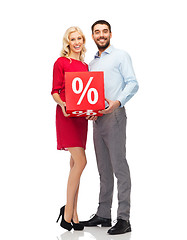 Image showing happy couple with red sale sign