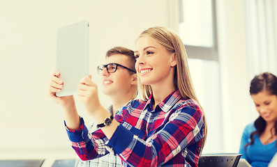 Image showing group of smiling students with tablet pc