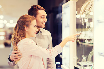 Image showing couple looking to shopping window at jewelry store