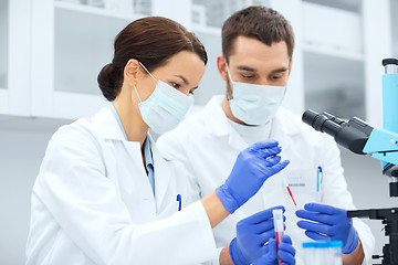 Image showing young scientists making test or research in lab