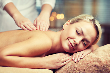 Image showing close up of woman lying and having massage in spa