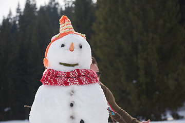 Image showing couple having fun and walking in snow shoes