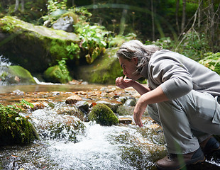 Image showing man drinking fresh water from spring