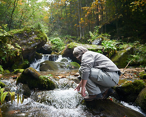 Image showing man drinking fresh water from spring