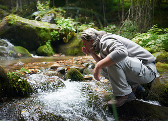 Image showing man drinking fresh water from spring