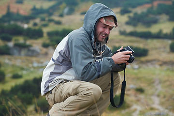 Image showing hiking man prepare tasty sausages on campfire