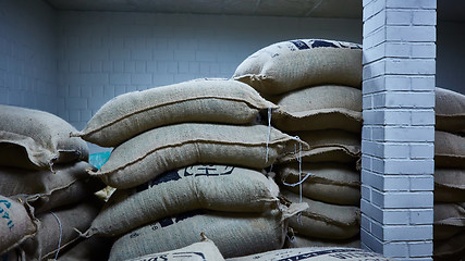 Image showing stack of burlap sacks with coffee beans