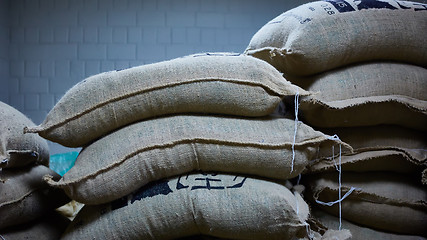 Image showing stack of burlap sacks with coffee beans