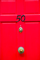 Image showing red handle in   rusty  brass nail and light